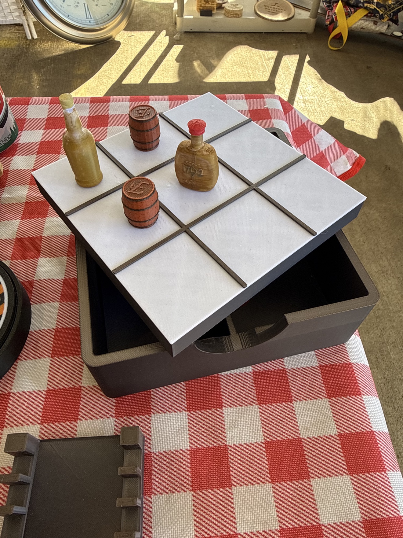 Bourbon and Barrels 3D printed tic-tac-toe game with barrel and bottle pieces