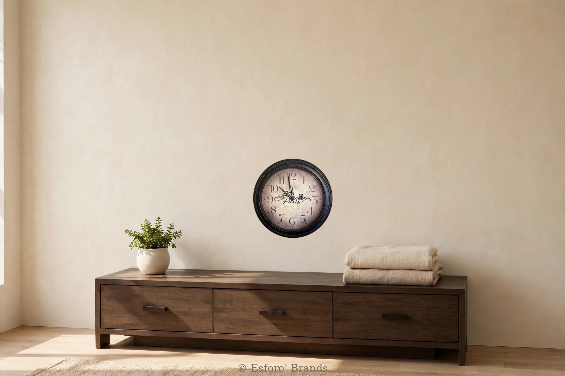 Paris upcycled wall clock with Arabic numerals and the Eiffel Tower and Paris skyline on the face, hanging in a bedroom