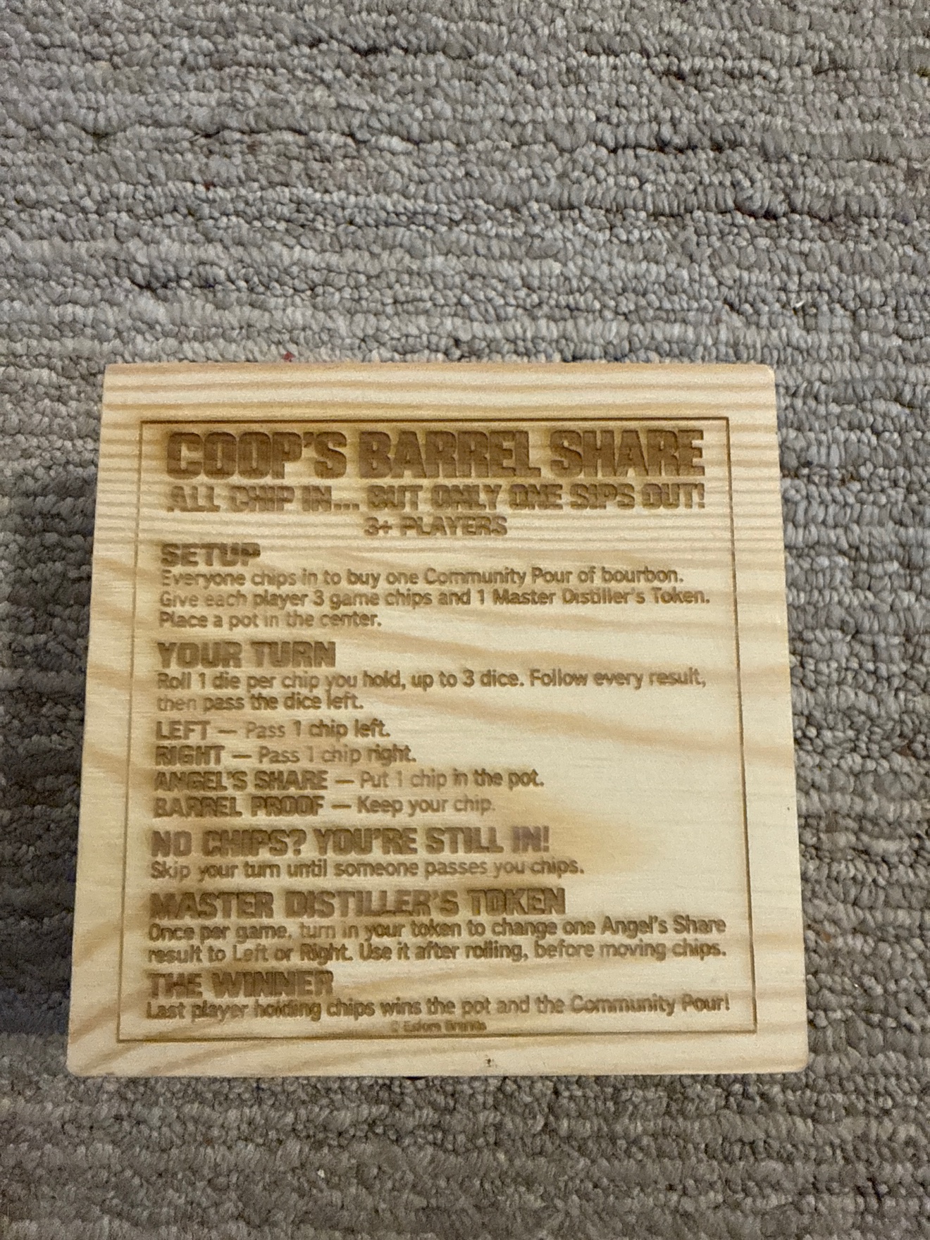 Coop's Barrel Share rules engraved on the underside of the box