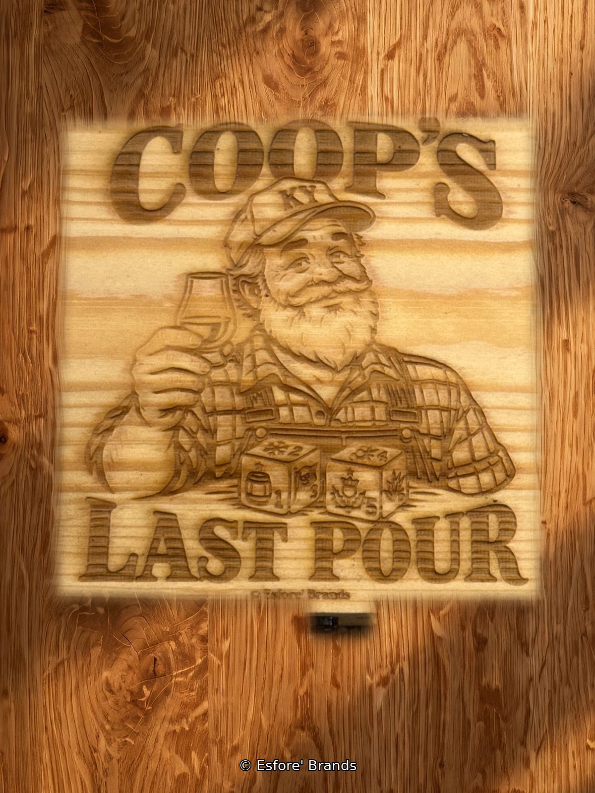 Coop's Last Pour bourbon dice game in a laser-engraved wooden box, on a bar top