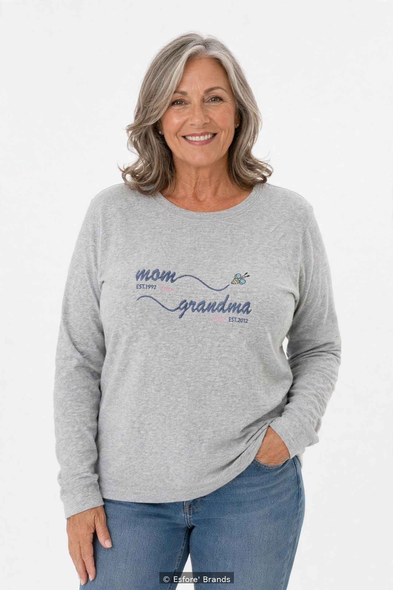 Model wearing the Mom Grandma EST embroidered long sleeve T-shirt with personalized years