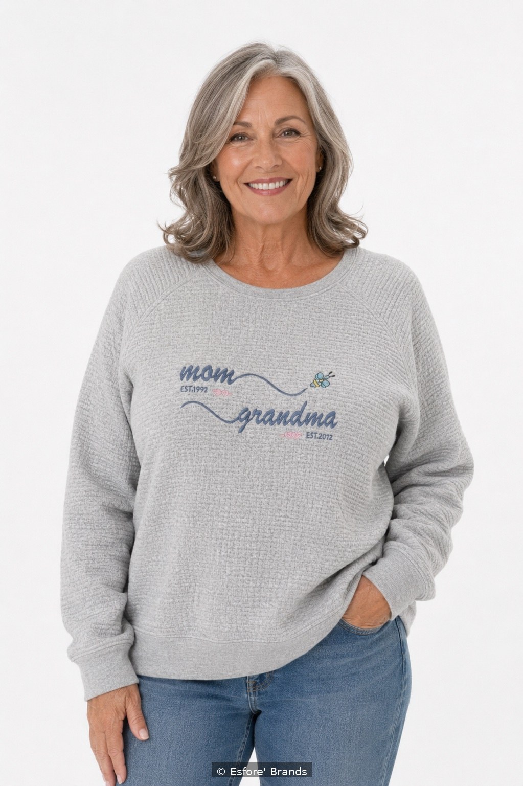 Model wearing the Mom Grandma EST embroidered sweatshirt with personalized years