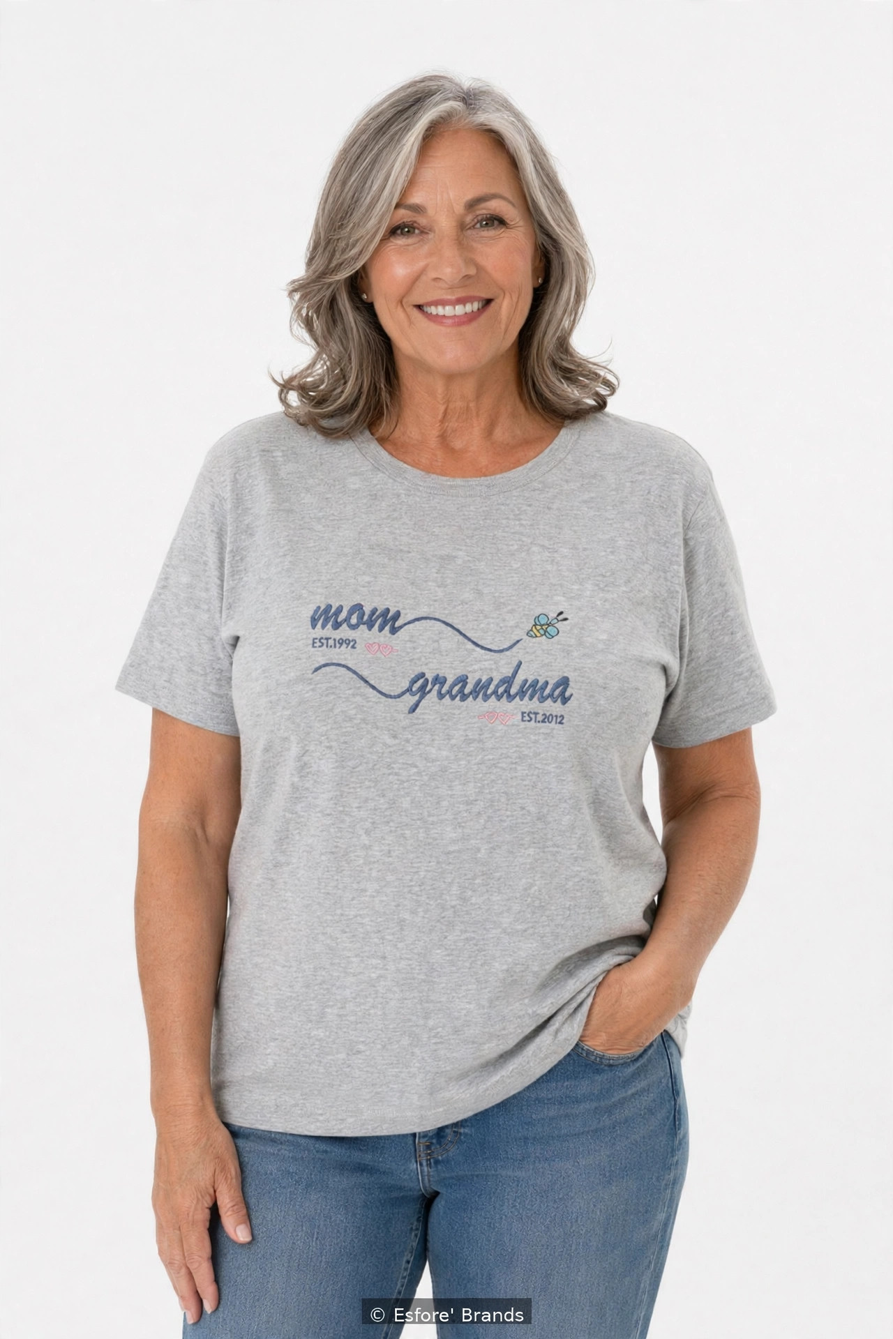 Model wearing the Mom Grandma EST embroidered T-shirt with personalized years
