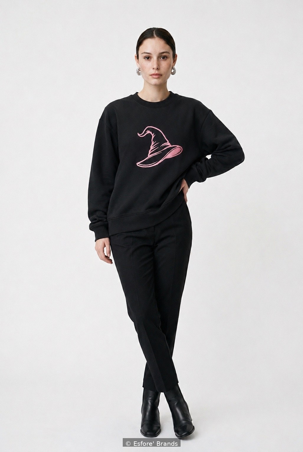 Model wearing the Pink Witch Hat embroidered sweatshirt